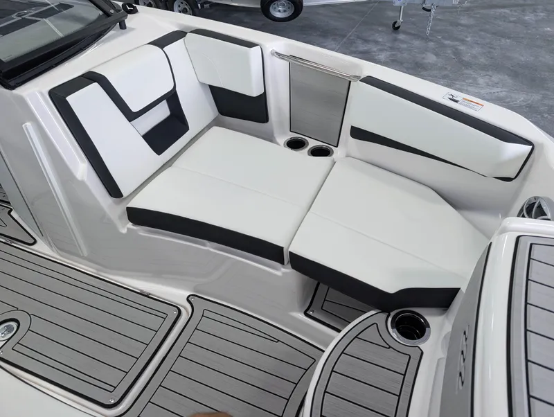 Slide: The Image of 2025 Yamaha Boats 222SE interior seating with sleek white and black design. - 28