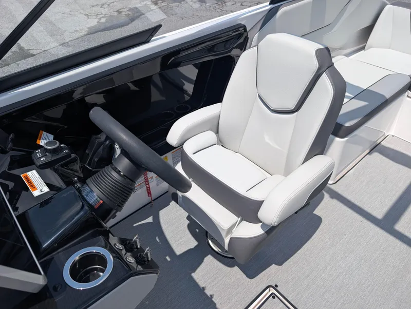 Slide: The Image of 2025 Yamaha Boats AR250 cockpit with modern steering and comfortable seating. - 12