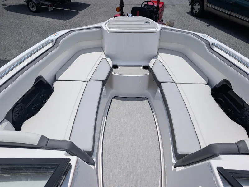 Slide: The Image of 2025 Yamaha Boats AR250 interior with spacious seating and modern design. - 15
