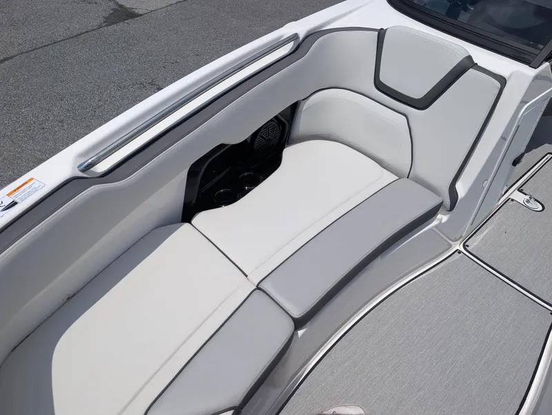 Slide: The Image of 2025 Yamaha AR250 boat interior with sleek, modern seating and cup holders. - 17