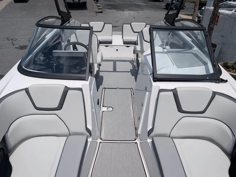 Slide: The Image of 2025 Yamaha Boats AR250 interior with sleek seating and modern design. - 18