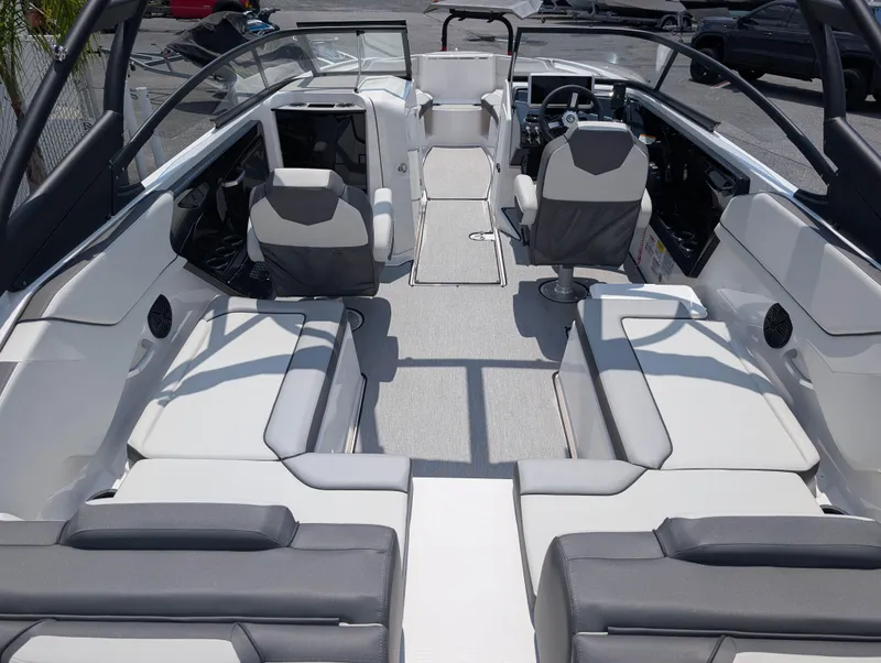 Slide: The Image of 2025 Yamaha Boats AR250 interior with spacious seating and modern design. - 8