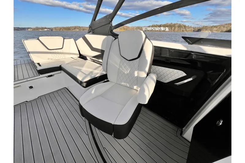 Slide: The Image of 2025 Yamaha Boats 252SE interior with modern seating and sleek design on the water. - 8