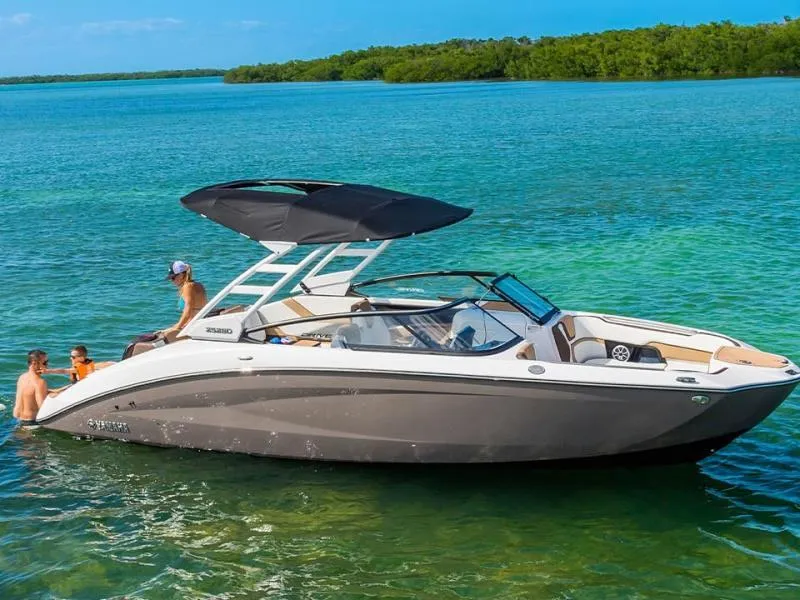 Slide: The Image of 2025 Yamaha Boats 252SD on clear blue water with passengers enjoying the sun. - 8