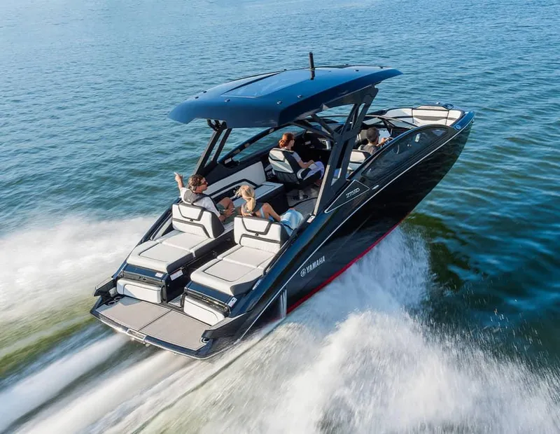 Slide: The Image of 2025 Yamaha Boats 275 SD cruising on open water with passengers enjoying the ride. - 10