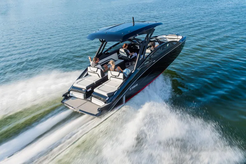 Slide: The Image of 2025 Yamaha Boats 275 SD cruising on open water with passengers enjoying the ride. - 3