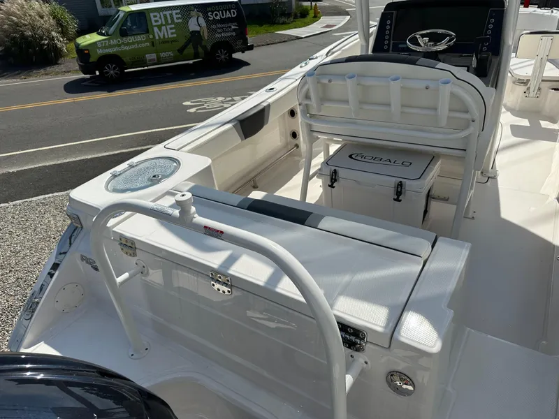 Slide: The Image of 2025 Robalo R230 Center Console boat interior with seating and storage. - 2
