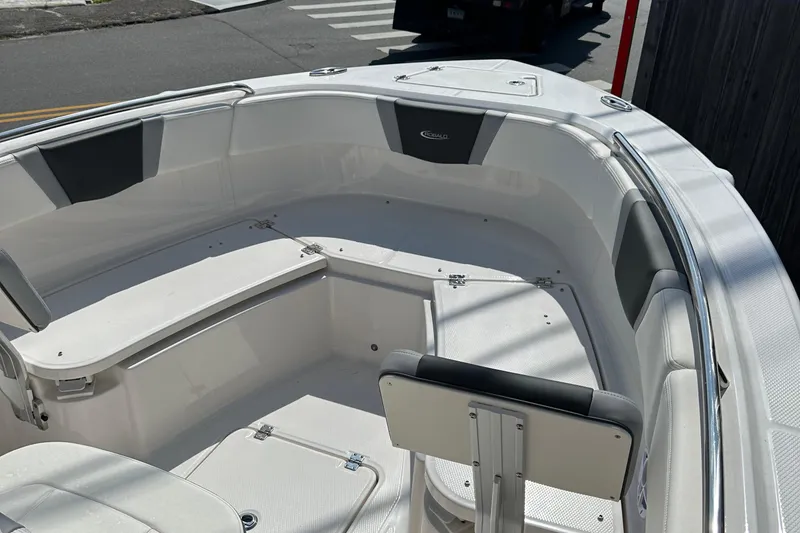Slide: The Image of 2025 Robalo R230 Center Console boat interior with seating and storage. - 6