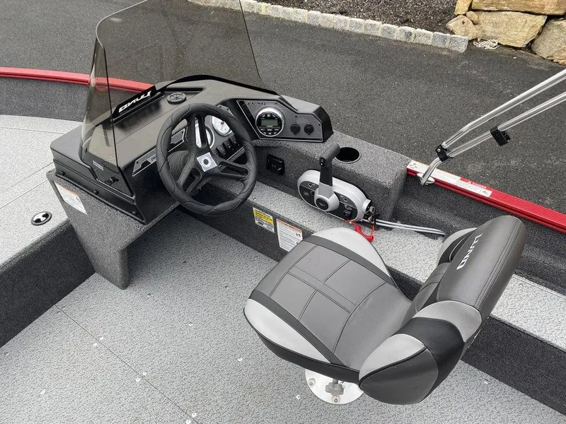 Slide: The Image of 2025 Lund 1650 Angler boat interior with steering console and seat. - 7