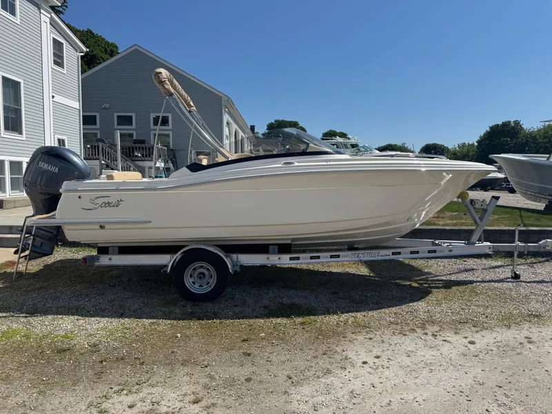 Slide: The Image of 2025 Scout 215 Dorado boat on trailer, parked outdoors, with Yamaha engine. - 3
