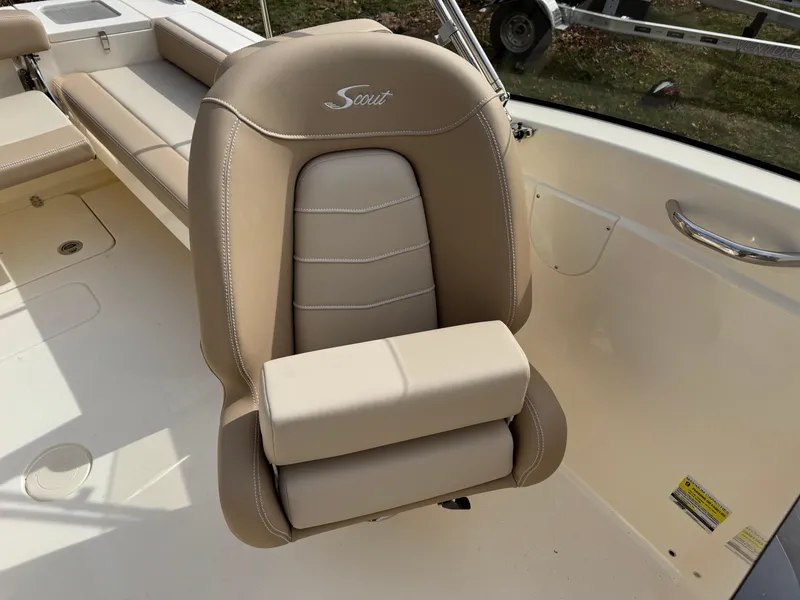 Slide: The Image of Beige captain's chair on 2025 Scout 215 Dorado boat, featuring sleek design and comfortable seating. - 33