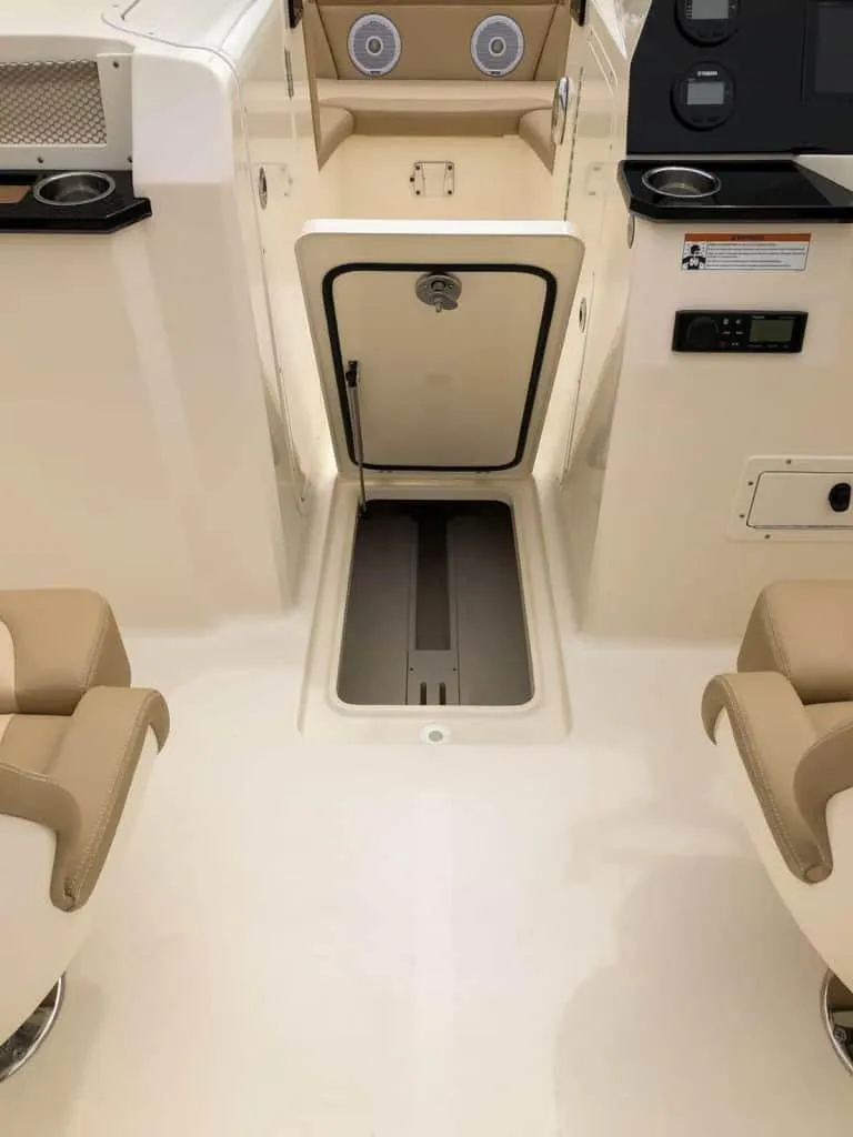 Slide: The Image of 2025 Scout 215 Dorado boat interior with seating and storage compartments. - 55