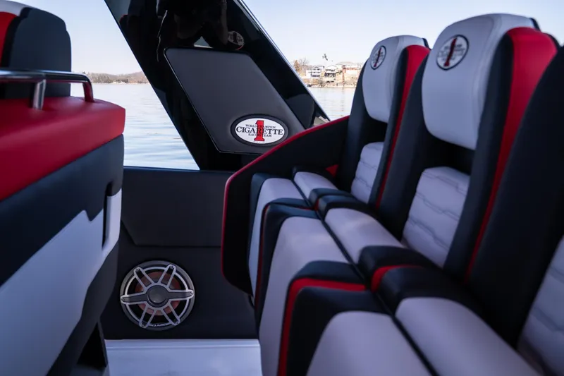 Slide: The Image of Interior of 2025 Cigarette 41 Nighthawk boat with stylish seating and speaker system. - 16