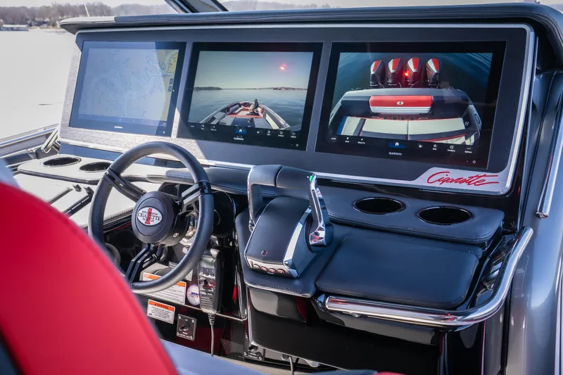 Slide: The Image of 2025 Cigarette 41 Nighthawk dashboard with advanced navigation screens and sleek steering wheel. - 18