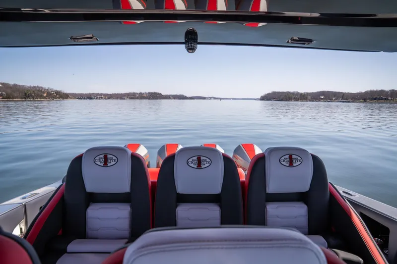 Slide: The Image of 2025 Cigarette 41 Nighthawk boat interior with lake view, featuring sleek seating design. - 20