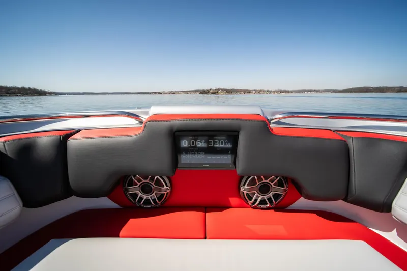 Slide: The Image of Interior view of 2025 Cigarette 41 Nighthawk boat with modern dashboard and speakers. - 25