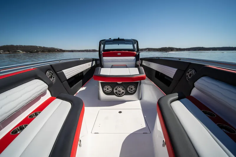 Slide: The Image of 2025 Cigarette 41 Nighthawk boat interior with red and white seating on a sunny day. - 26