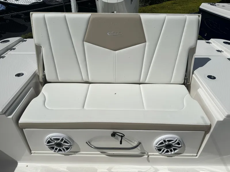 Slide: The Image of 2025 Robalo 266 Cayman SD boat seat with built-in speakers and storage. - 13