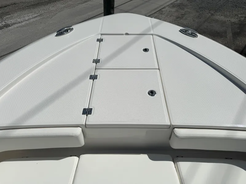 Slide: The Image of 2025 Robalo 266 Cayman SD boat deck with storage compartments. - 19