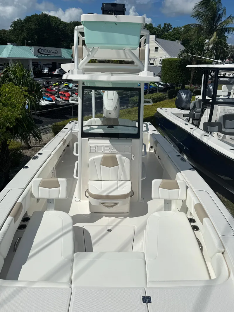 Slide: The Image of 2025 Robalo 266 Cayman SD boat with spacious seating and modern design. - 23