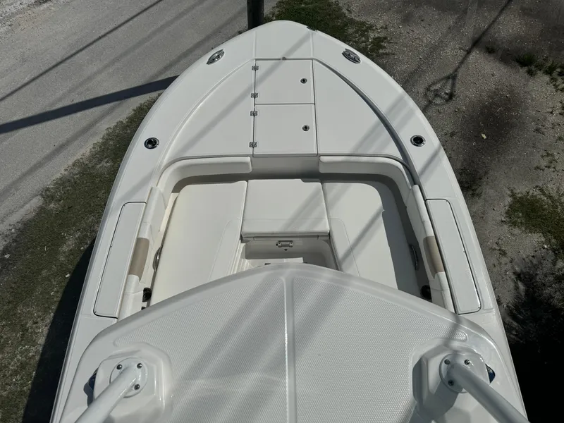Slide: The Image of 2025 Robalo 266 Cayman SD boat deck, white finish, spacious seating area. - 30
