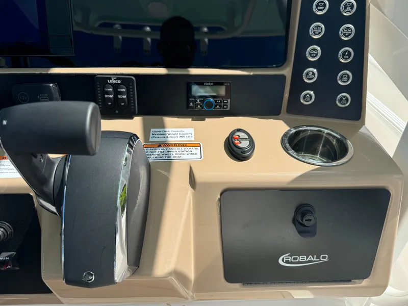 Slide: The Image of Control panel of 2025 Robalo 266 Cayman SD boat with throttle and switches. - 33