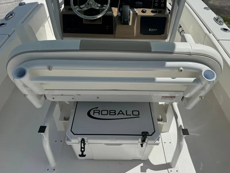 Slide: The Image of 2025 Robalo 266 Cayman SD boat interior with seating and storage. - 8