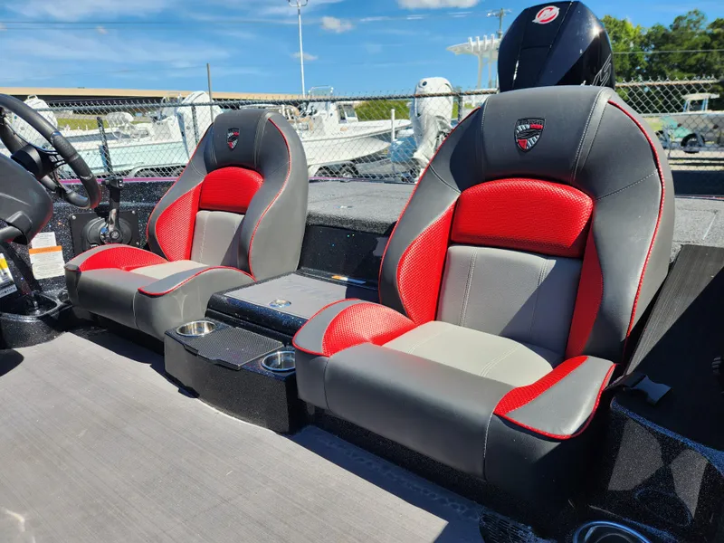 Slide: The Image of 2024 Triton 18 TrX boat seats with red and gray design, featuring cup holders. - 13