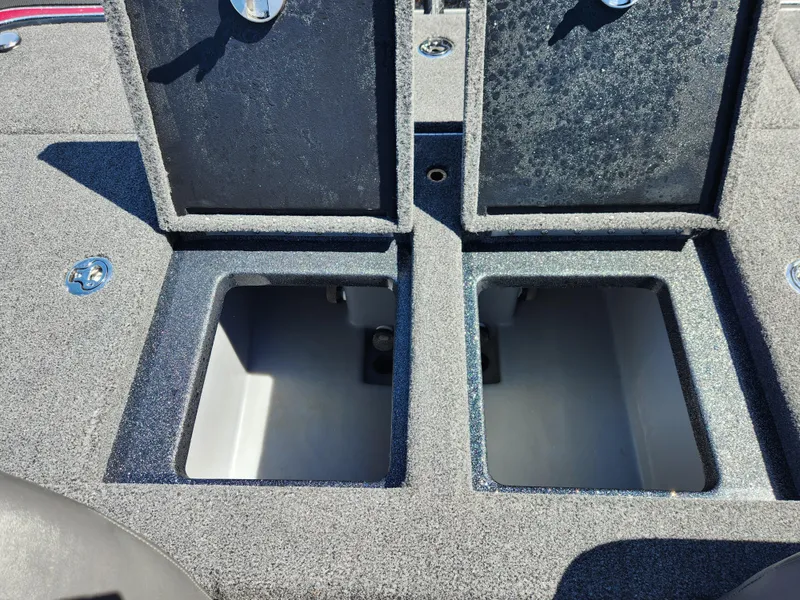 Slide: The Image of 2024 Triton 18 TrX boat storage compartments open, showcasing interior space. - 20