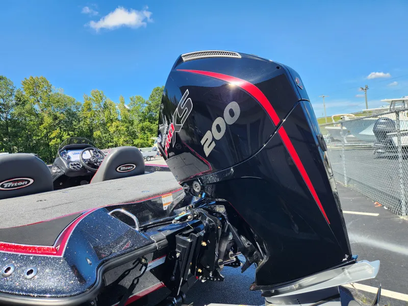 Slide: The Image of 2024 Triton 18 TrX boat with powerful 200 HP engine, sleek design. - 4