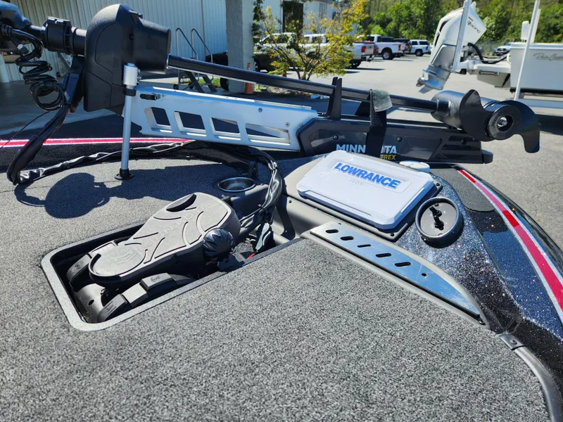 Slide: The Image of 2024 Triton 18 TrX boat deck with Minn Kota trolling motor and Lowrance electronics. - 6