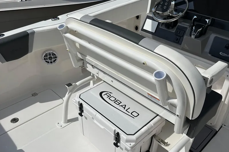 Slide: The Image of 2025 Robalo R250 Center Console boat interior with seating and storage. - 12