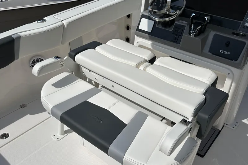 Slide: The Image of 2025 Robalo R250 Center Console boat interior with sleek seating and modern console design. - 13