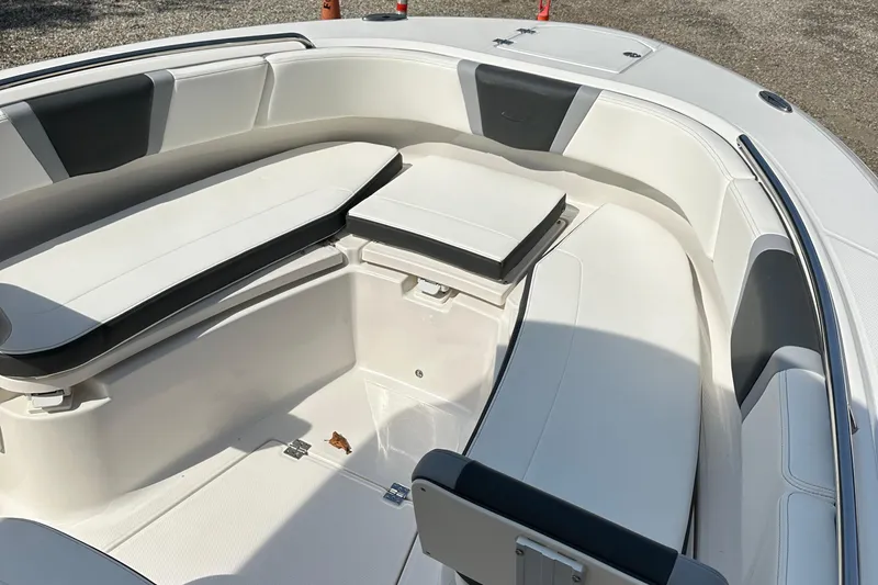 Slide: The Image of 2025 Robalo R250 Center Console boat interior with cushioned seating. - 14