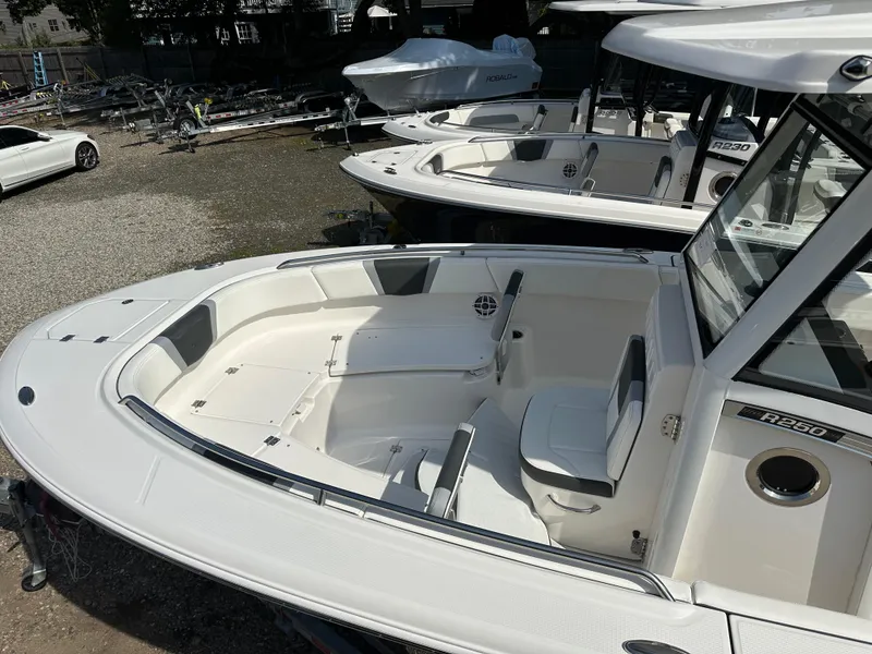 Slide: The Image of 2025 Robalo R250 Center Console boat with spacious seating and sleek design. - 5