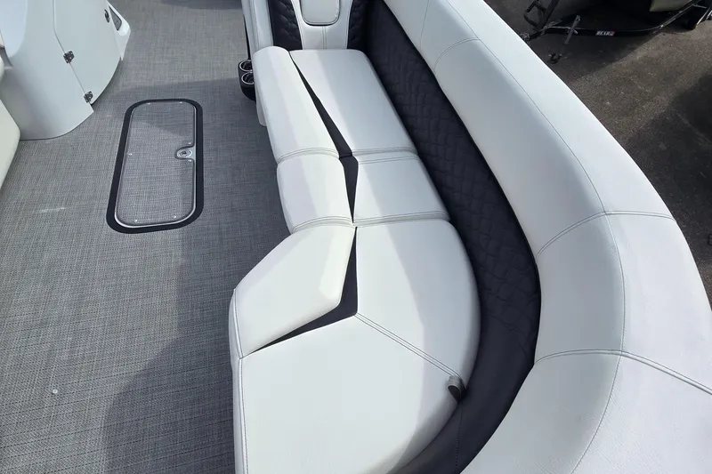 Slide: The Image of Luxurious seating on 2025 Manitou 27 boat with sleek design and comfortable upholstery. - 7