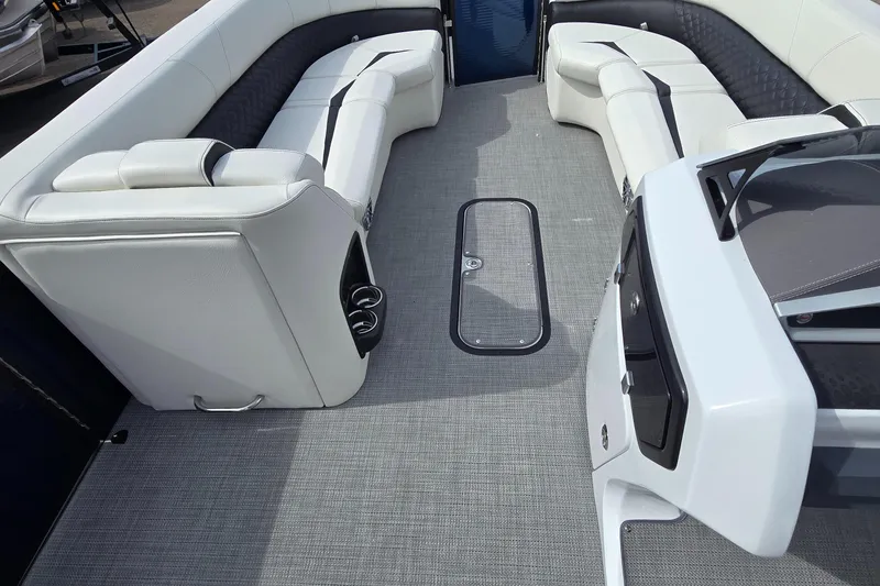 Slide: The Image of Luxurious interior of 2025 Manitou 27 boat with plush seating and modern design. - 8