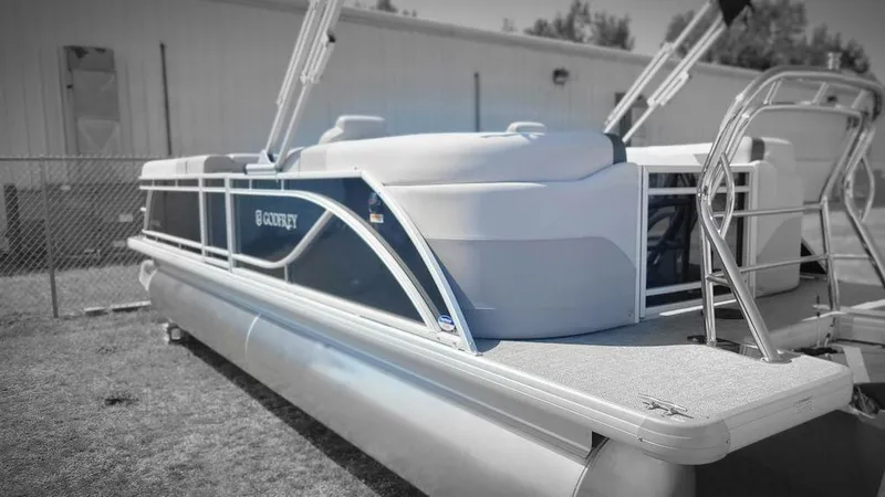 Slide: The Image of 2025 Godfrey SWEETWATER 2286 SB pontoon boat, docked outdoors, side view. - 5