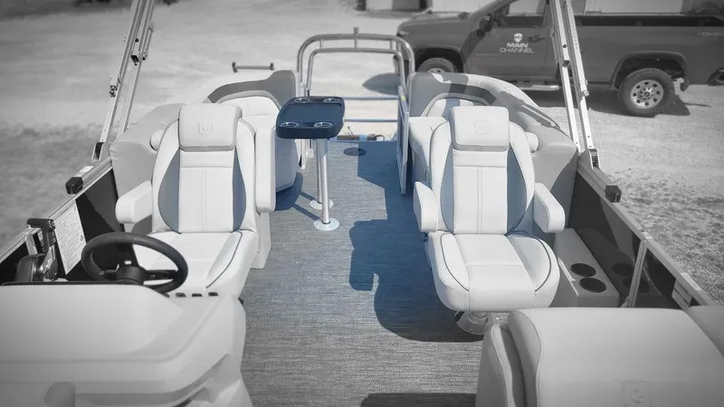 Slide: The Image of 2025 Godfrey SWEETWATER 2286 SB pontoon boat interior with plush seating and steering wheel. - 8