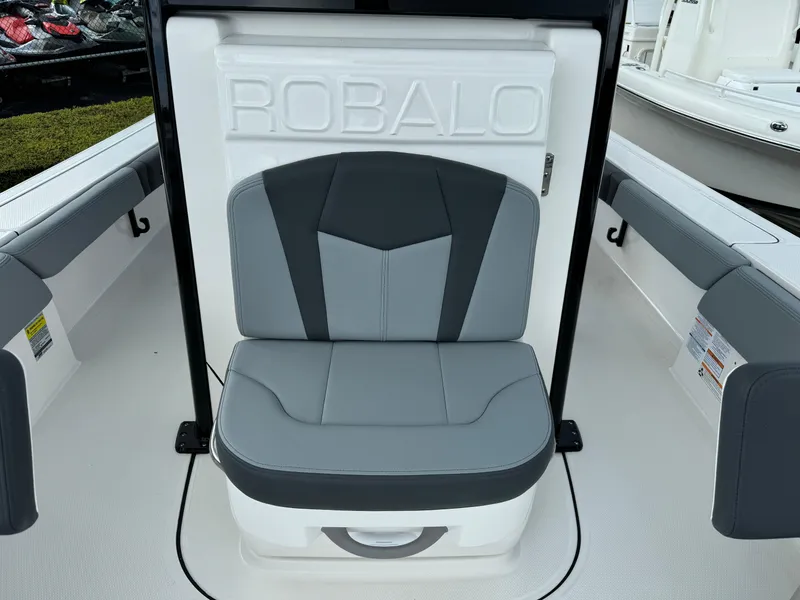 Slide: The Image of 2025 Robalo 246 Cayman boat seat with gray and black upholstery. - 14