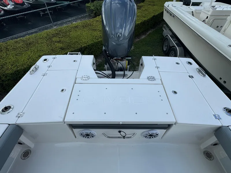 Slide: The Image of 2025 Robalo 246 Cayman boat deck with engine and storage compartments. - 27