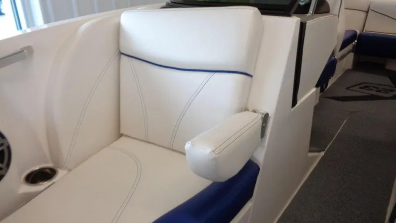 Slide: The Image of 2017 MasterCraft X23 interior with white and blue seating, featuring modern design and comfort. - 11