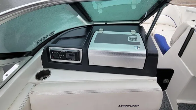 Slide: The Image of 2017 MasterCraft X23 boat interior with control panel and seating. - 18