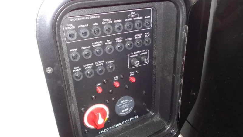 Slide: The Image of 2017 MasterCraft X23 12VDC distribution panel with switches and controls. - 22