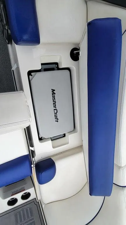 Slide: The Image of 2017 MasterCraft X23 boat interior with blue and white seating. - 31