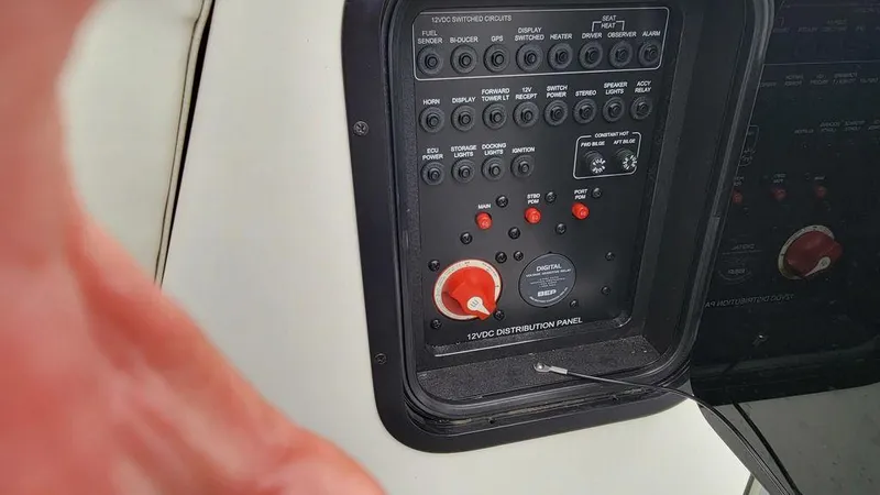 Slide: The Image of Control panel of a 2017 MasterCraft X23 boat with various switches and dials. - 6