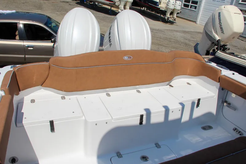 Slide: The Image of 2025 Sea Hunt Ultra 275 SE boat with dual engines and spacious seating. - 16