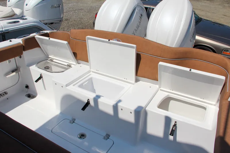 Slide: The Image of 2025 Sea Hunt Ultra 275 SE boat storage compartments and seating area. - 17