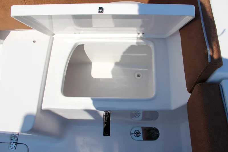 Slide: The Image of Open storage compartment on 2025 Sea Hunt Ultra 275 SE boat. - 18