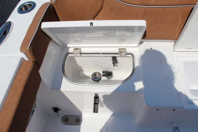 Slide: The Image of 2025 Sea Hunt Ultra 275 SE boat interior with open storage compartment. - 20